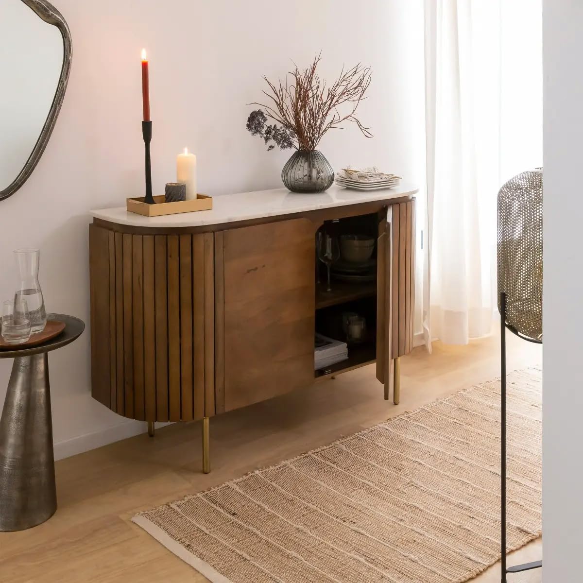 Solid mango wood antique sliding door storage cabinet for living room with marble top, open interior shelves stocked with crockery