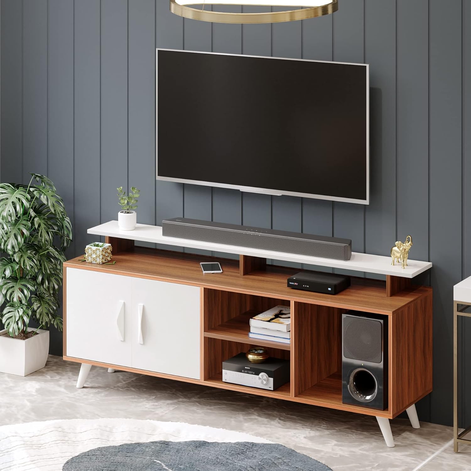 Compact walnut and white TV unit with angled legs, closed cabinet door, and open shelves for small living rooms and bedrooms